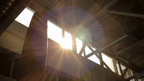 Sun shining high under ceiling 스톡 동영상 77875960