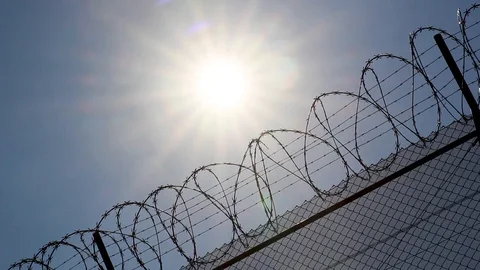 Sun Shining Over A Barbed Wire Fence Vidéo 127885209