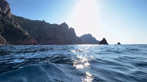 Sun shining over Calanques de Piana rock formations in Corsica Vídeos de archivo 276702487