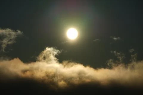 The sun shining over the clouds in the sky. Stock Photos