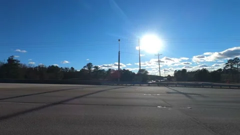 Sun shining over a highway and country landscape Stock Footage 152171666