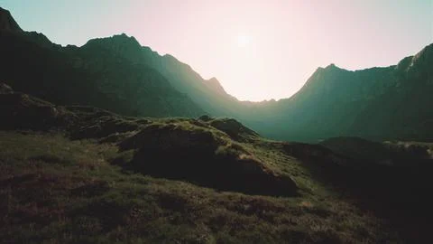 The sun is shining over a mountain range. mountain sunset Stock Illustration