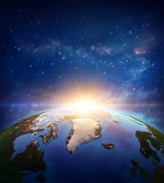 Sun shining over North Pole and Arctic Ocean from space 写真素材