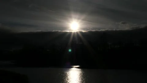 The sun is shining over the river. Glare shines on the surface of the water Stock Footage 164897139