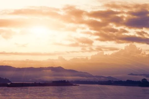 Sun shining over river. Stock Photos
