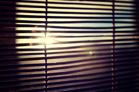 Sun shining through the blinds Stock Photos