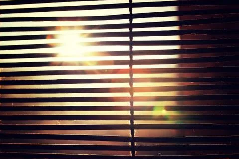 Sun shining through the blinds Stock Photos