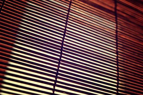 Sun shining through the blinds Stock Photos