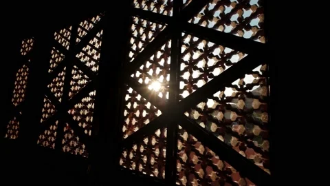 Sun shining through carved window shades close Video stock 161123585