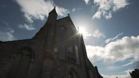 Sun shining through cathedral stained glass window, religion, faith Stock Footage 144606020