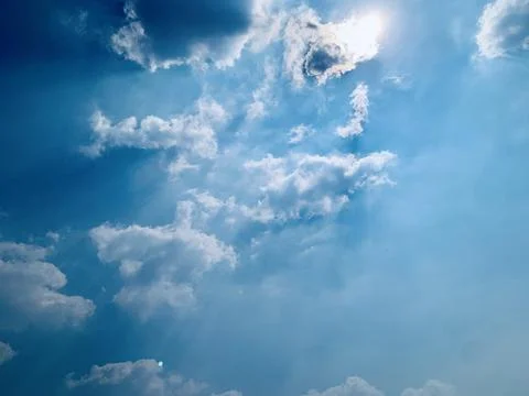 Sun Shining Through Clouds in Blue Sky Over Jakarta Indonesia Stock Photos