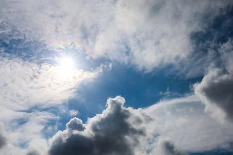 Sun shining through clouds with bright sky 스톡 사진