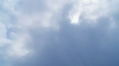Sun shining through clouds Stock Footage