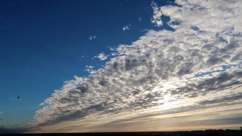 Sun shining through clouds Stock Footage 220364768