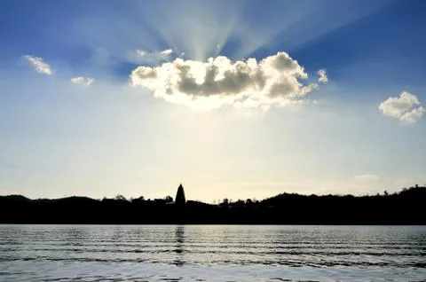 Sun shining through clouds Stock Photos