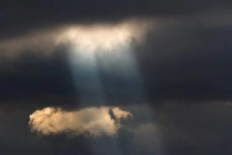 Sun shining through the clouds Stock Photos