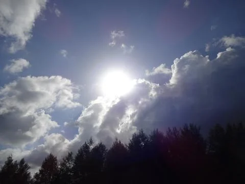 Sun Shining Through Clouds Stock Photos