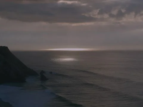 Sun shining through clouds on the sea in Portugal, Sintra Stock Footage 302505463