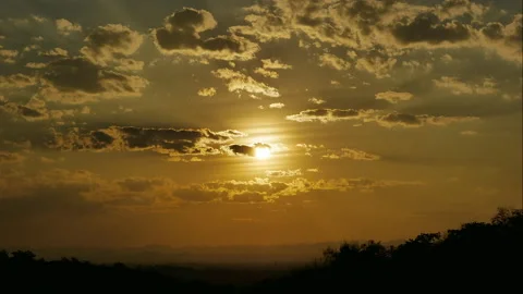 Sun shining through cumulus clouds, Dramatic sky at sunset Stock-Footage 262540734