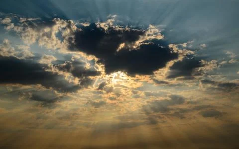 Sun Shining Through Dark Clouds Stock Photos