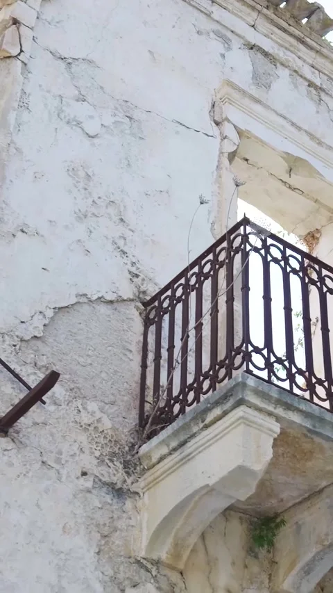 Sun shining through derelict building windows and balconies Видео 294963925