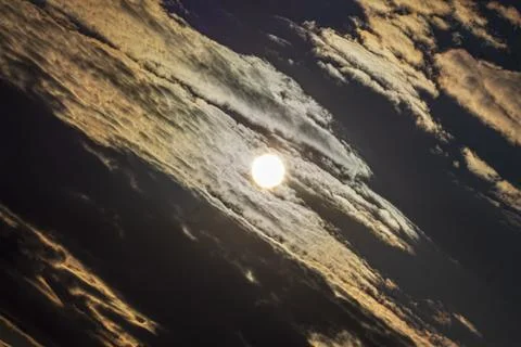 Sun shining through dramatic clouds 库存照片