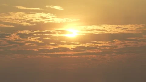 Sun shining through layered clouds Stock Footage 340982210