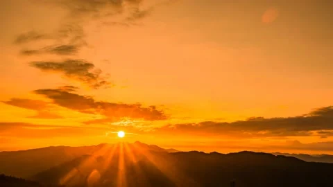 Sun shining through the mountain ridge. Time lapse. Stock Footage 145742785