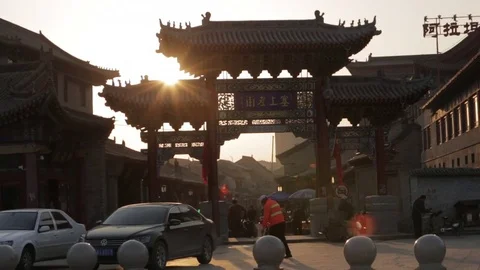 Sun shining through a pedestrian gate in China Stock Footage 75212313
