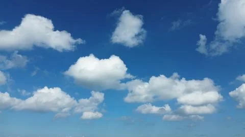 Sun shining through the puffy clouds. Stock Photos
