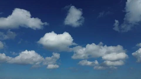 Sun shining through the puffy clouds. Stock Photos