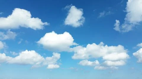 Sun shining through the puffy clouds. Stock Photos