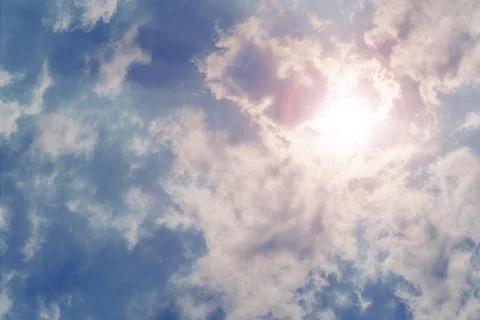 Sun shining through rain clouds Foto stock