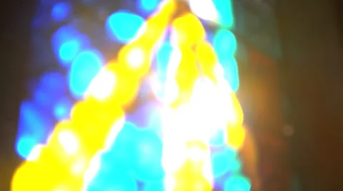 Sun shining through stained glass window Stock Footage