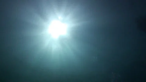 Sun shining through water Stock Footage 33109263