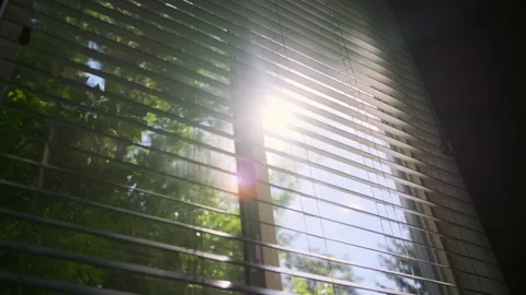 Sun shining through window blinds close. Slow motion footage Vidéo 218625921