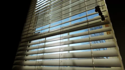 Sun shining through window blinds close. Close up, move camera Video stock 269740387
