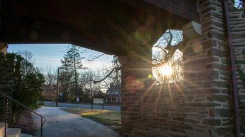 The Sun Shining Through a Window in a Cobblestone Wall Stock Photos