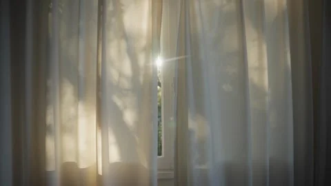 Sun shining through window curtain inside house or apartment in early morning Видео 322780889