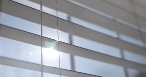 Sun shining through window shades close 動画素材 144063944