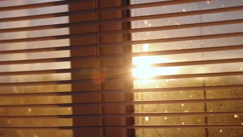 Sun shining through window shades close. Abstract blurred sunlight goes through Video stock 196002363