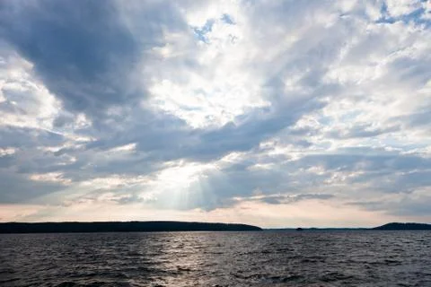 Sun shining thru clouds Stock Photos