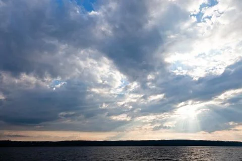 Sun shining thru clouds Stock Photos