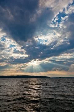 Sun shining thru clouds Stock Photos