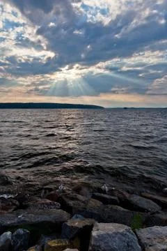 Sun shining thru clouds Stock Photos