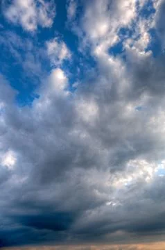 Sun shining thru clouds Stock Photos