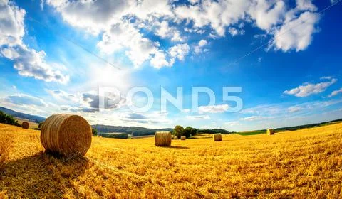The sun shining upon rural landscape Stock Photos