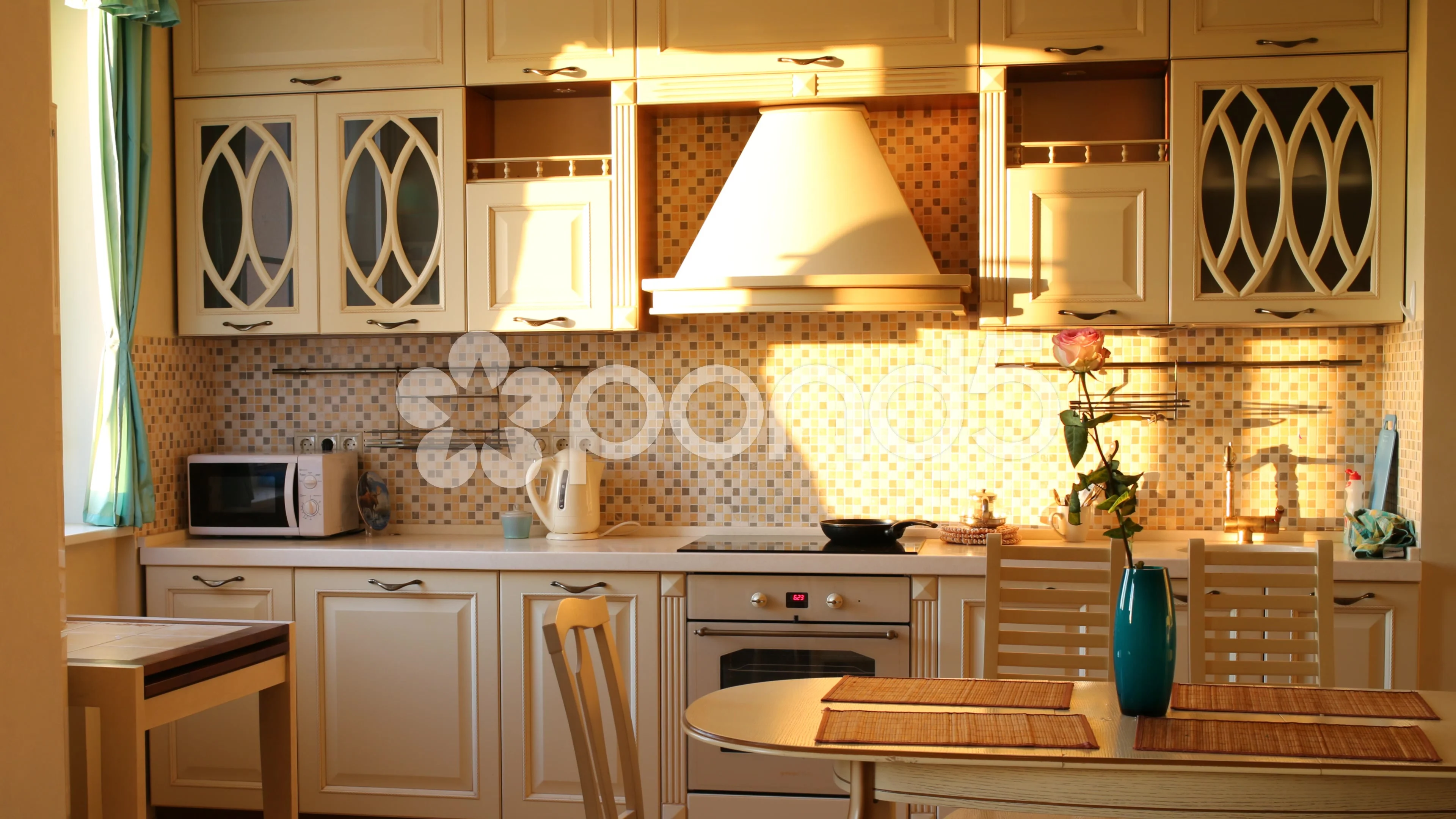 The sun is shining from a window in a modern kitchen. Time lapse.