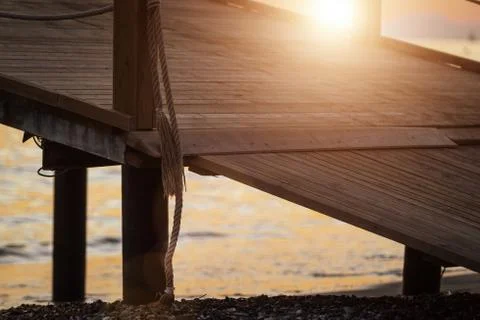 Sun shining on wooden pier Stock Photos