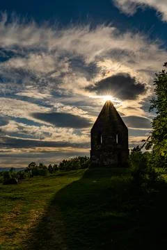 The Sun shinning through the clouds over the Penrith Beacon in the English La Stock Photos